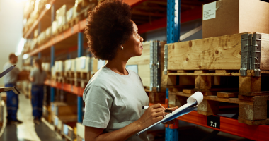 Female warehouse worker with clipboard