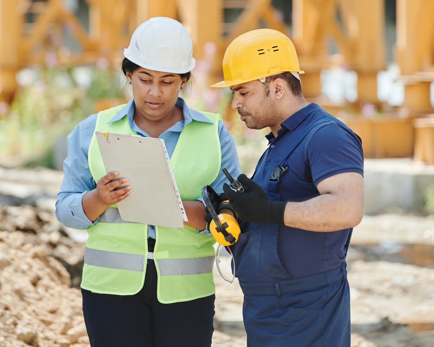 Name Construction Worker And Manager Looking At Clipboard